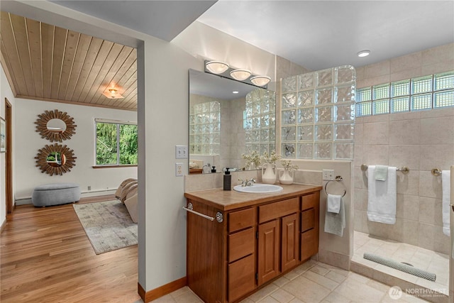 1840 Country Club Dr, East Wenatchee, WA 98802 - bathroom with a walk in shower, vanity, wood finished floors, and a baseboard radiator