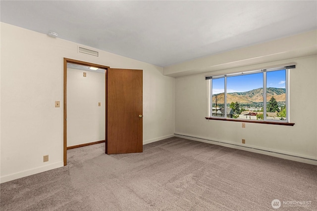 1840 Country Club Dr, East Wenatchee, WA 98802 - unfurnished room featuring a baseboard radiator, carpet, a mountain view, and a smoke detector