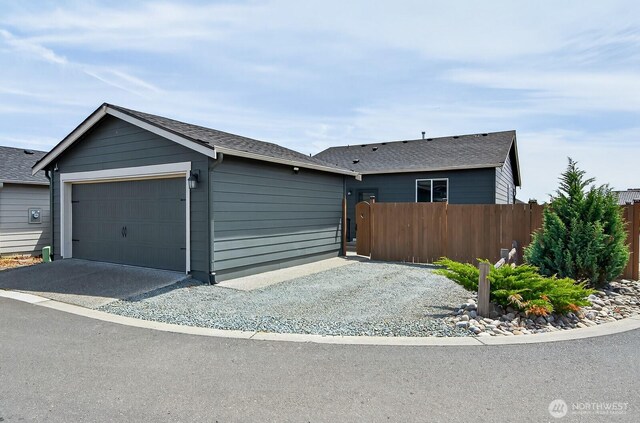 6729 283rd Pl NW, Stanwood, WA 98292 - single story home featuring a garage, driveway, and roof with shingles