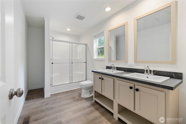 1264 Russell Dr, Coupeville, WA 98239 - bathroom with a shower stall, double vanity, wood finished floors, and recessed lighting