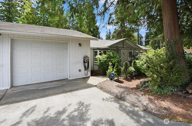 22609 58th Ave W, Mountlake Terrace, WA 98043 - view of front facade featuring an attached garage, concrete driveway, and roof with shingles