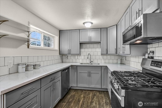 22609 58th Ave W, Mountlake Terrace, WA 98043 - kitchen featuring stainless steel appliances, gray cabinets, dark wood-style floors, and a textured ceiling
