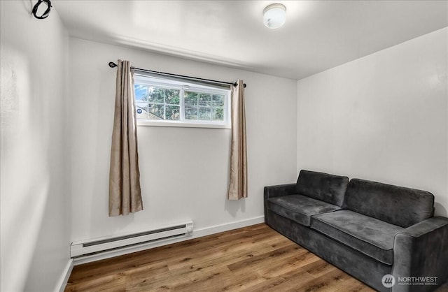 22609 58th Ave W, Mountlake Terrace, WA 98043 - sitting room featuring a baseboard heating unit and wood finished floors