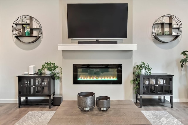7804 208th Ave E, Bonney Lake, WA 98391 - detailed view of wood finished floors and a glass covered fireplace