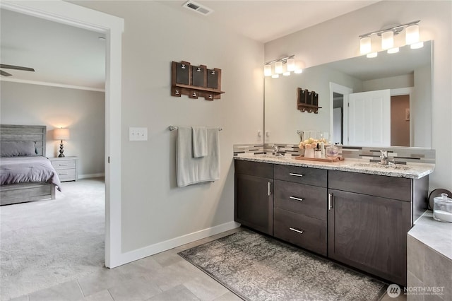 7804 208th Ave E, Bonney Lake, WA 98391 - ensuite bathroom with double vanity and ceiling fan