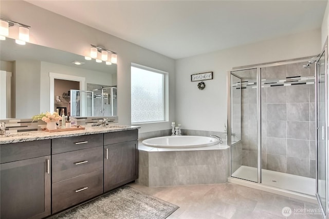 7804 208th Ave E, Bonney Lake, WA 98391 - bathroom featuring a shower stall, double vanity, tile patterned flooring, and a garden tub