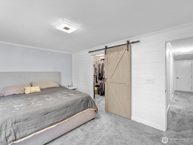 25107 Old Owen Rd, Monroe, WA 98272 - bedroom with ornamental molding, carpet, a walk in closet, a barn door, and a closet