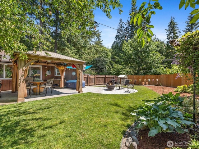 25107 Old Owen Rd, Monroe, WA 98272 - fenced backyard featuring a fire pit, a patio, and a hot tub