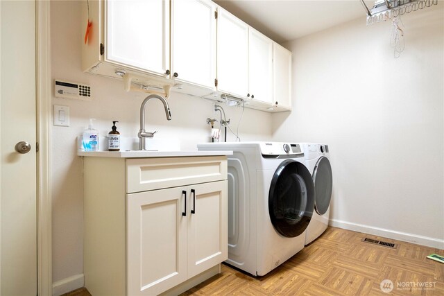 5265 140th Ave NE, Bellevue, WA 98005 - laundry room featuring cabinet space and washer and clothes dryer