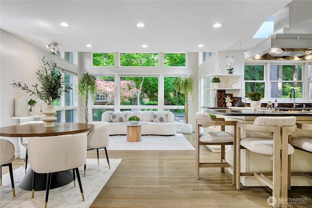 5265 140th Ave NE, Bellevue, WA 98005 - dining area featuring plenty of natural light, a skylight, recessed lighting, and light wood-style floors