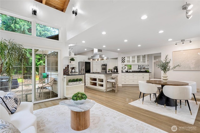 5265 140th Ave NE, Bellevue, WA 98005 - living room with light wood finished floors, recessed lighting, and a towering ceiling
