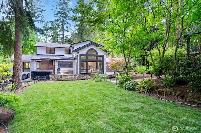 5265 140th Ave NE, Bellevue, WA 98005 - back of house with a yard, stone siding, and a shingled roof