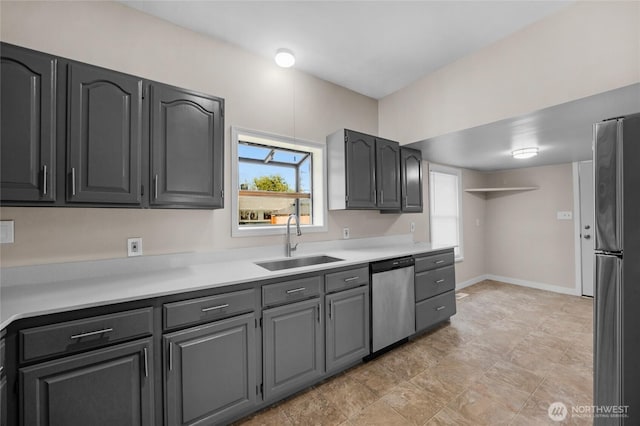 1925 Lombard Unit A, Everett, WA 98201 - kitchen with appliances with stainless steel finishes, plenty of natural light, light countertops, and gray cabinets