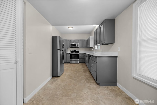 1925 Lombard Unit A, Everett, WA 98201 - kitchen with stainless steel appliances, gray cabinetry, and light countertops