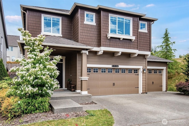 2726 Kacie Ct NE, Lacey, WA 98516 - view of front of house featuring concrete driveway, a garage, and a shingled roof