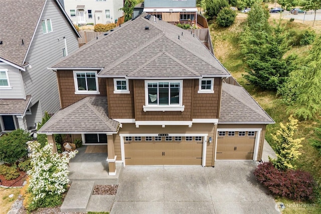 2726 Kacie Ct NE, Lacey, WA 98516 - view of front of property with a shingled roof, driveway, covered porch, and an attached garage