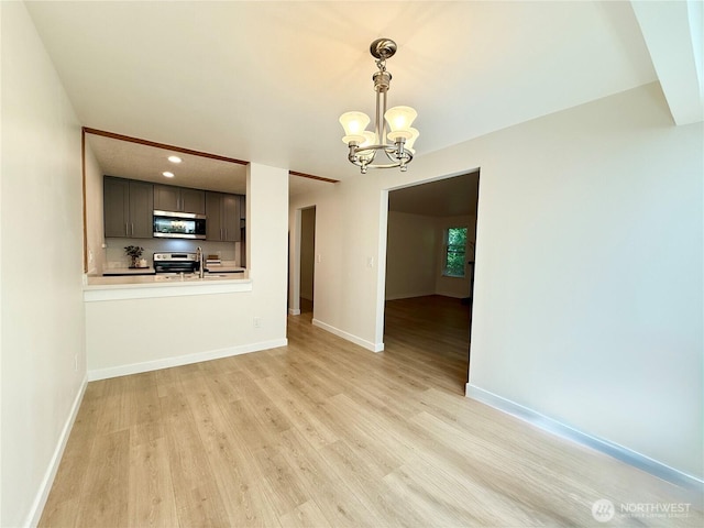 147 S 329th Pl Unit A, Federal Way, WA 98003 - unfurnished dining area with a chandelier, light wood-style flooring, and recessed lighting