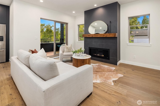 9047 Dibble Ave NW, Seattle, WA 98117 - living area with recessed lighting, light wood finished floors, and a large fireplace