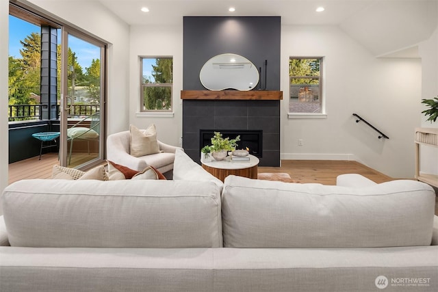 9047 Dibble Ave NW, Seattle, WA 98117 - living room with wood finished floors, recessed lighting, and a fireplace