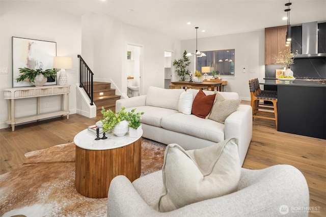 9047 Dibble Ave NW, Seattle, WA 98117 - living area featuring stairs, wood finished floors, and recessed lighting