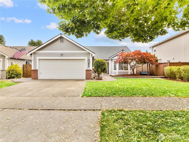 5415 Komachin Loop SE, Lacey, WA 98513 - view of front facade with brick siding, driveway, and an attached garage