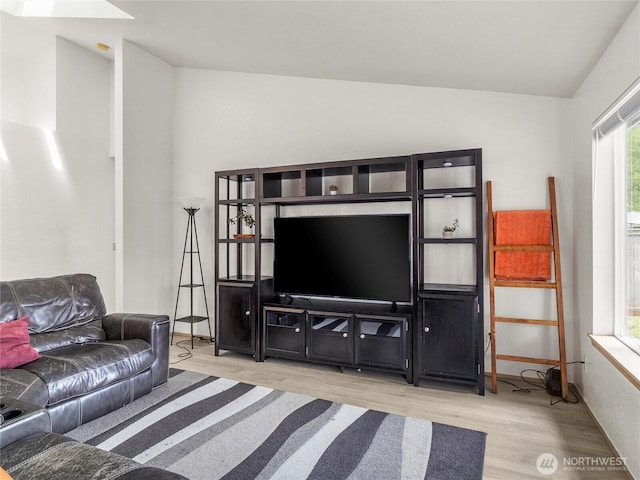 5415 Komachin Loop SE, Lacey, WA 98513 - living area featuring wood finished floors, a skylight, and vaulted ceiling
