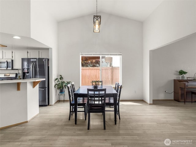 5415 Komachin Loop SE, Lacey, WA 98513 - dining area with high vaulted ceiling and light wood finished floors