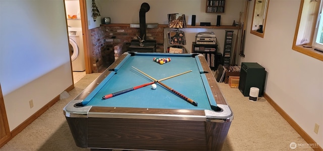 2904 271st St, Ocean Park, WA 98640 - rec room with pool table, carpet flooring, washer / dryer, and a wood stove