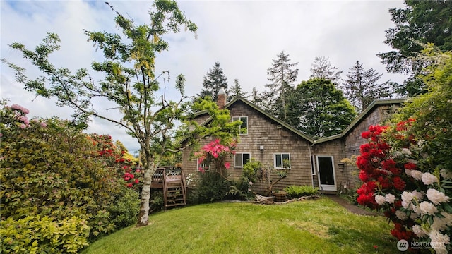 2904 271st St, Ocean Park, WA 98640 - back of house with a lawn, a deck, a chimney, and stairs