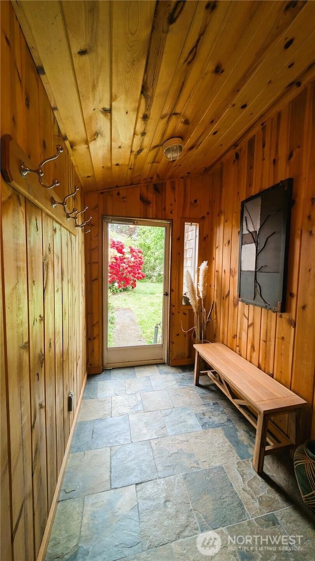 2904 271st St, Ocean Park, WA 98640 - mudroom with stone tile floors, wooden walls, and wooden ceiling