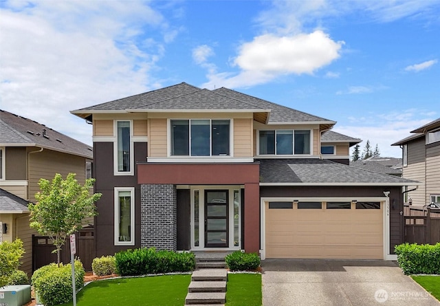 13506 196th Ave SE, Monroe, WA 98272 - view of front facade with driveway, an attached garage, and a shingled roof