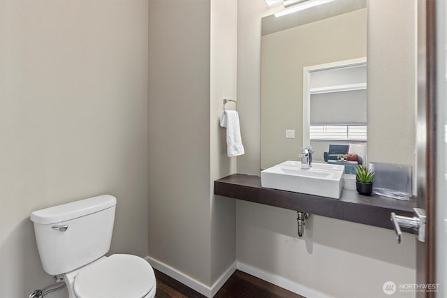 13506 196th Ave SE, Monroe, WA 98272 - half bathroom featuring a sink and wood finished floors