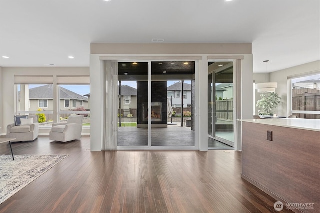 13506 196th Ave SE, Monroe, WA 98272 - doorway featuring wood finished floors, a fireplace, and recessed lighting