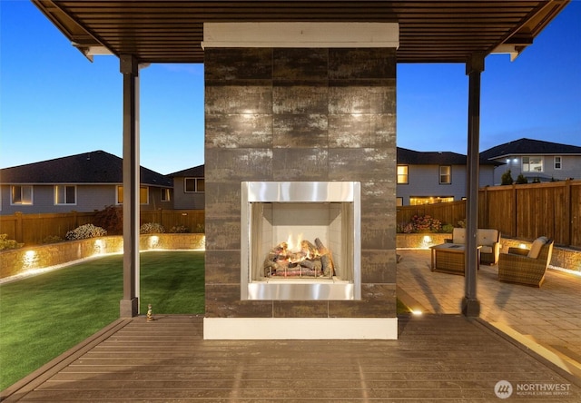 13506 196th Ave SE, Monroe, WA 98272 - wooden deck featuring a warm lit fireplace