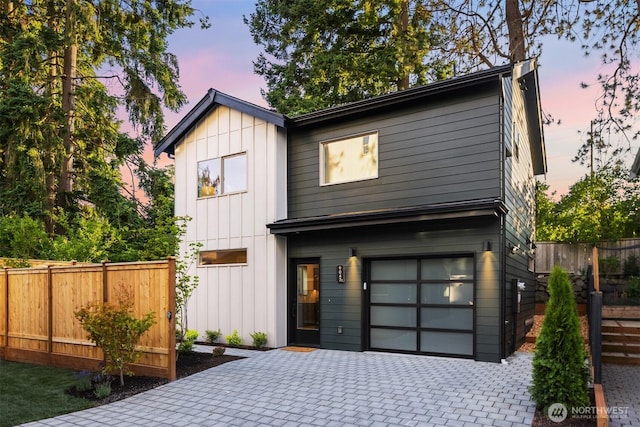 9047 Dibble Ave NW Unit C, Seattle, WA 98117 - view of front facade with board and batten siding, an attached garage, and decorative driveway