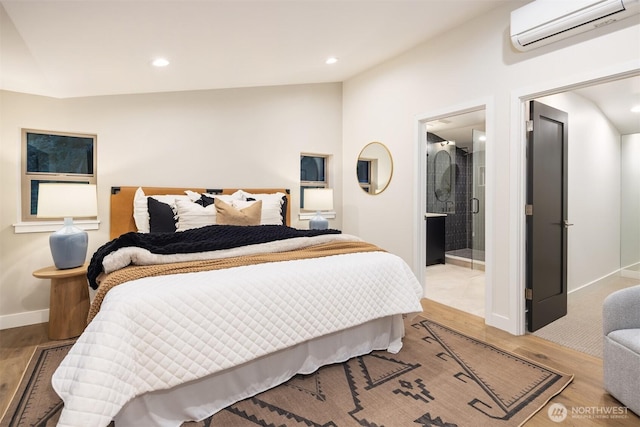 9047 Dibble Ave NW Unit C, Seattle, WA 98117 - bedroom with a wall mounted air conditioner, wood finished floors, recessed lighting, vaulted ceiling, and ensuite bathroom