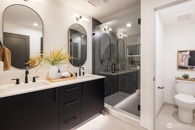 9047 Dibble Ave NW Unit C, Seattle, WA 98117 - full bathroom with double vanity, tile patterned flooring, a stall shower, and recessed lighting
