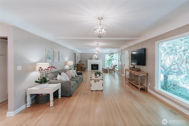 1325 SW 120th St, Burien, WA 98146 - living room featuring light wood-style flooring, a chandelier, and a fireplace