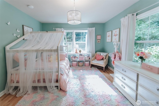 1325 SW 120th St, Burien, WA 98146 - bedroom with a chandelier and wood finished floors