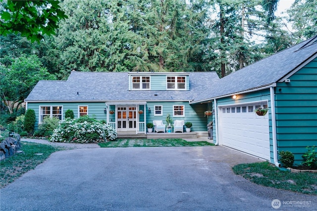 1325 SW 120th St, Burien, WA 98146 - view of front of house featuring asphalt driveway, a garage, and roof with shingles