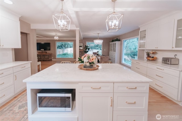1325 SW 120th St, Burien, WA 98146 - kitchen with a chandelier, glass insert cabinets, light wood-style flooring, and white cabinets