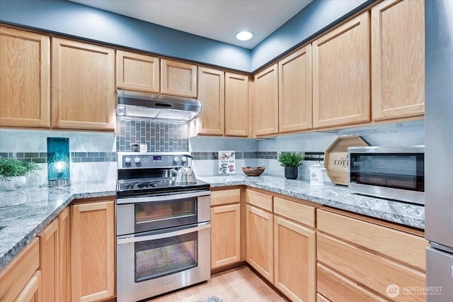 2001 120th Pl SE Unit 3-104, Everett, WA 98208 - kitchen with appliances with stainless steel finishes, under cabinet range hood, and light brown cabinetry