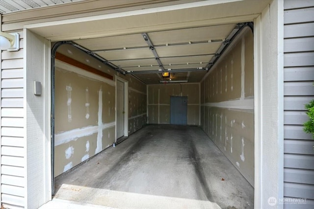 2001 120th Pl SE Unit 3-104, Everett, WA 98208 - garage featuring a garage door opener