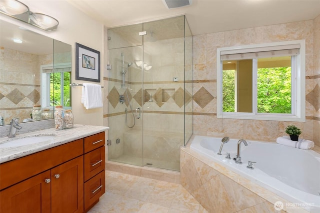 5310 143rd Ave SE, Bellevue, WA 98006 - full bathroom with vanity, a garden tub, a shower stall, healthy amount of natural light, and tile walls