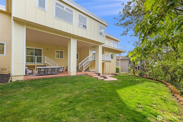 5310 143rd Ave SE, Bellevue, WA 98006 - back of house featuring board and batten siding, stairs, a yard, and a patio area
