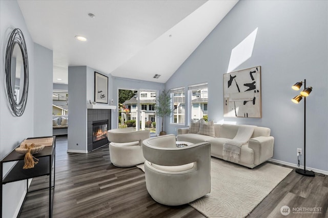 4714 Fairwood Blvd NE Unit 1301, Tacoma, WA 98422 - living area with dark wood-style flooring, a tile fireplace, high vaulted ceiling, and recessed lighting