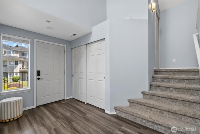 4714 Fairwood Blvd NE Unit 1301, Tacoma, WA 98422 - foyer entrance with dark wood-style flooring, stairs, and radiator heating unit