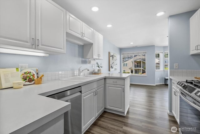 4714 Fairwood Blvd NE Unit 1301, Tacoma, WA 98422 - kitchen with appliances with stainless steel finishes, a peninsula, light countertops, white cabinetry, and recessed lighting