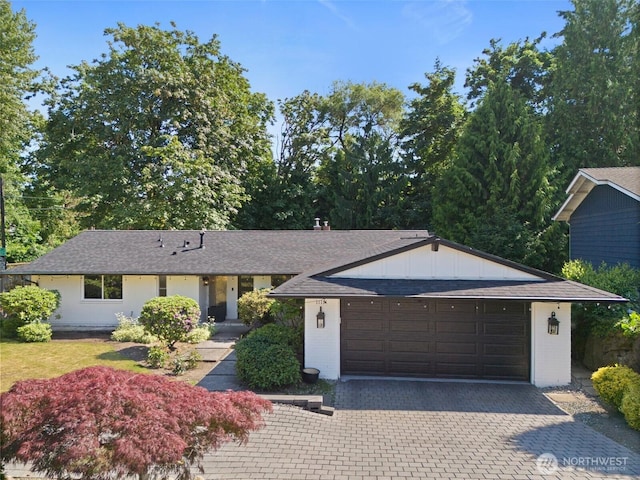 11171 SE 59th St, Bellevue, WA 98006 - ranch-style house featuring roof with shingles, driveway, and brick siding