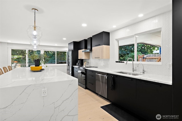 11171 SE 59th St, Bellevue, WA 98006 - kitchen with dark cabinetry, appliances with stainless steel finishes, modern cabinets, recessed lighting, and a center island